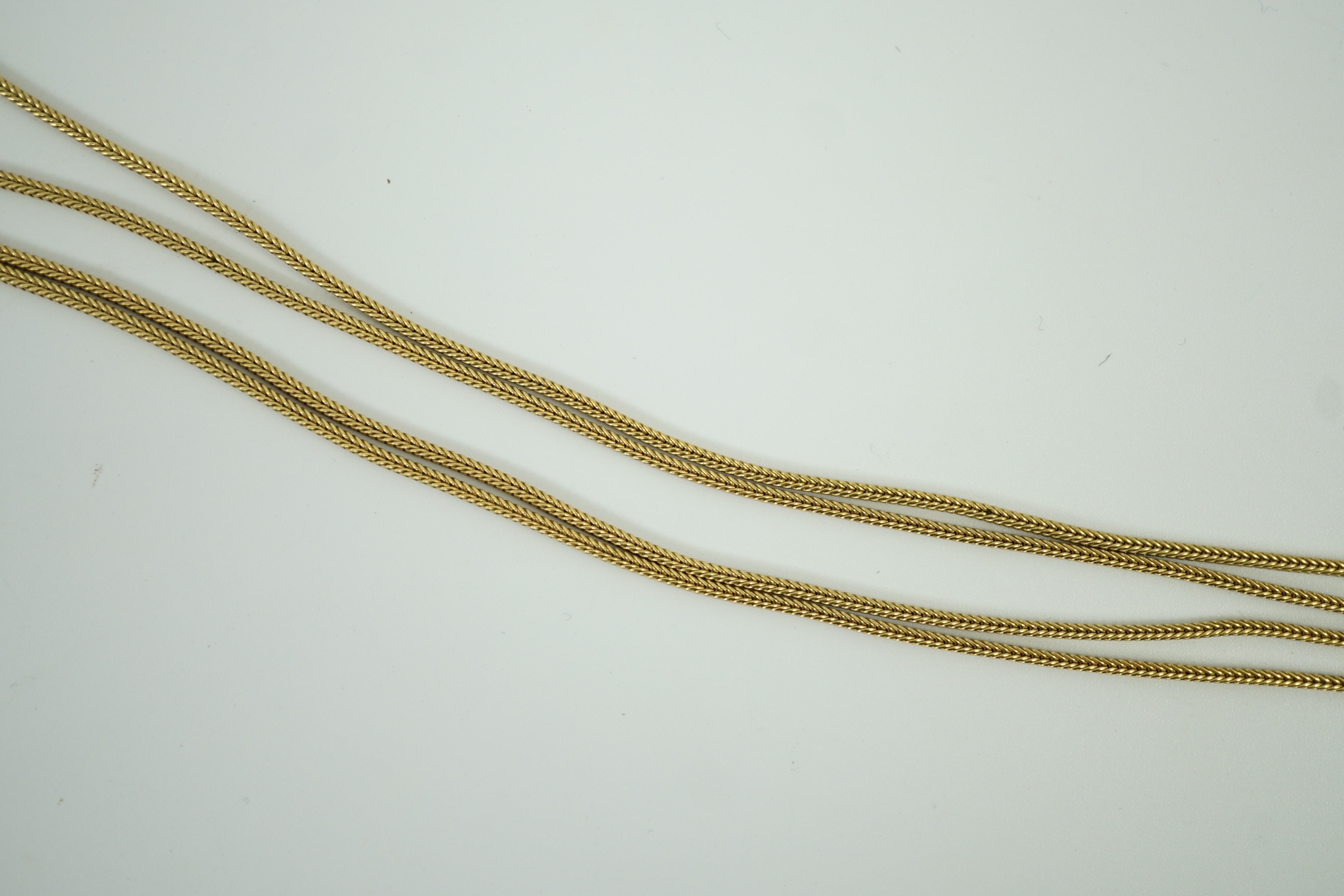 A modern 9ct gold quadruple strand tassel necklace, 56cm, 16.1 grams.